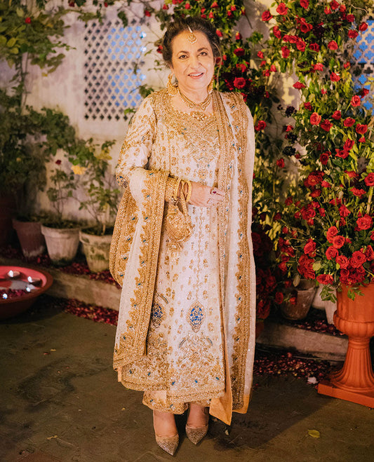 Our very own, Farah Talib Aziz celebrating her son's Nikkah in a timeless ivory and gold ganga-jamni classic kameez izaar.