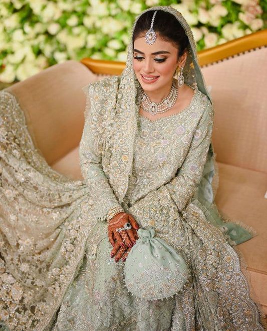 A BREATHTAKING BRIDE ON HER VALIMA DAY IN A ICE BLUE FARAH TALIB AZIZ SIGNATURE BRIDAL