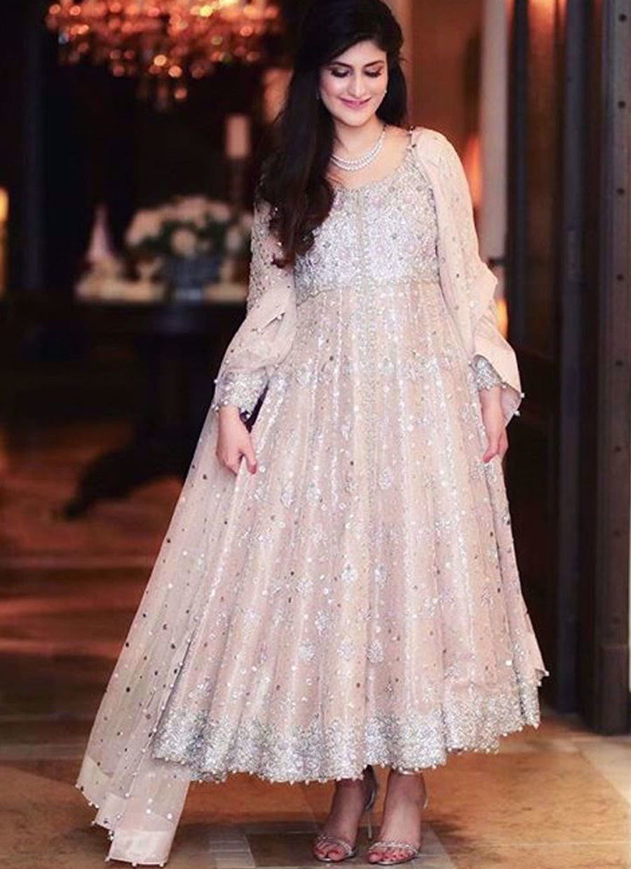Absolutely adoring this beautiful bride sparkling in a tea rose Farah Talib Aziz signature kalidaar peshwas