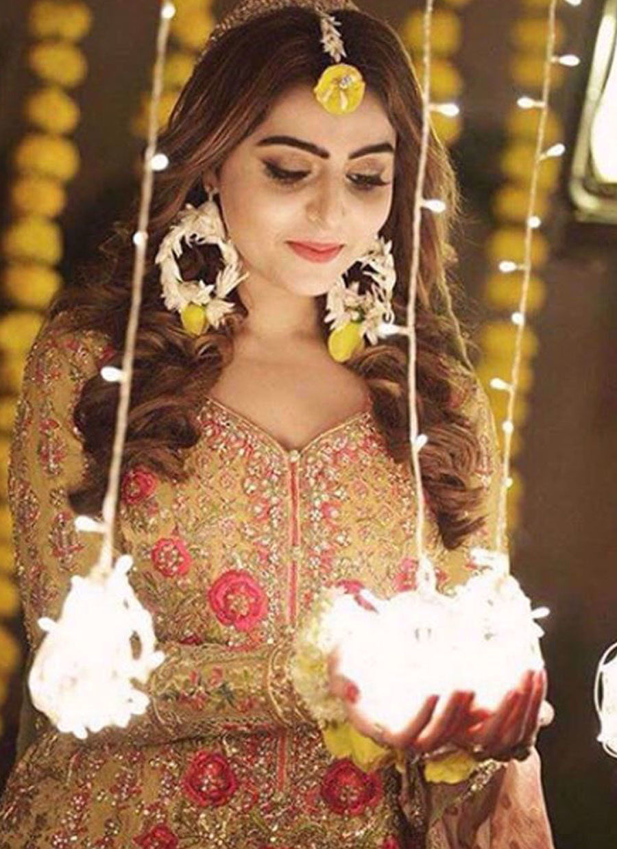 GLOWING IN A SAFFRON YELLOW KALIDAAR PAIRED WITH A MINT GHARARA