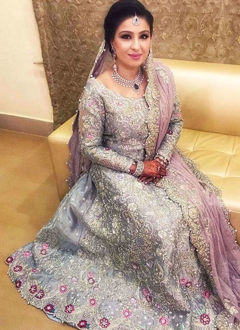 Bushra in an ice blue Farah Talib Aziz bridal featuring a filigree of silver and Swarovski embellishments