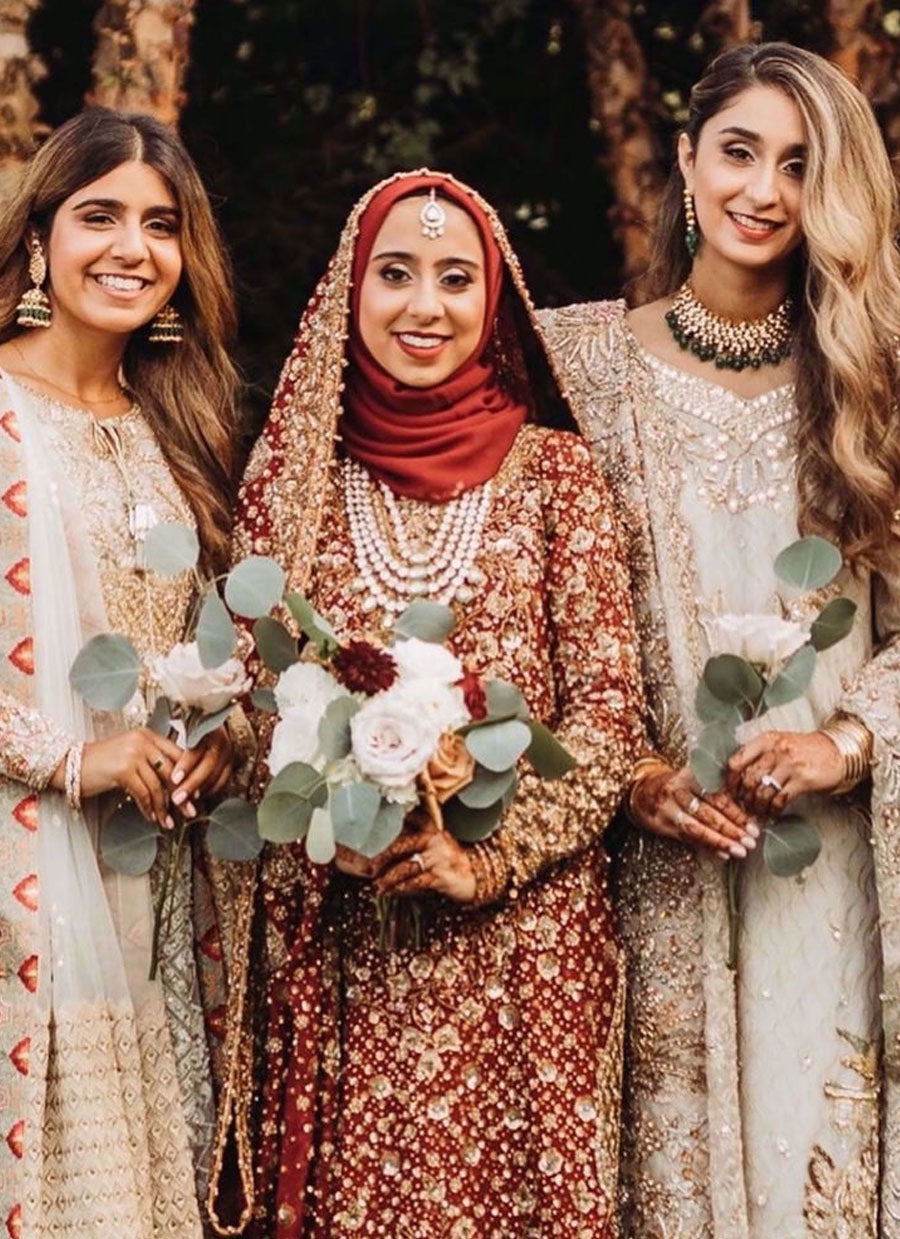 Marriyah Simjee In Traditional Shades of Reds Featuring Intricate Embellishments In Golds