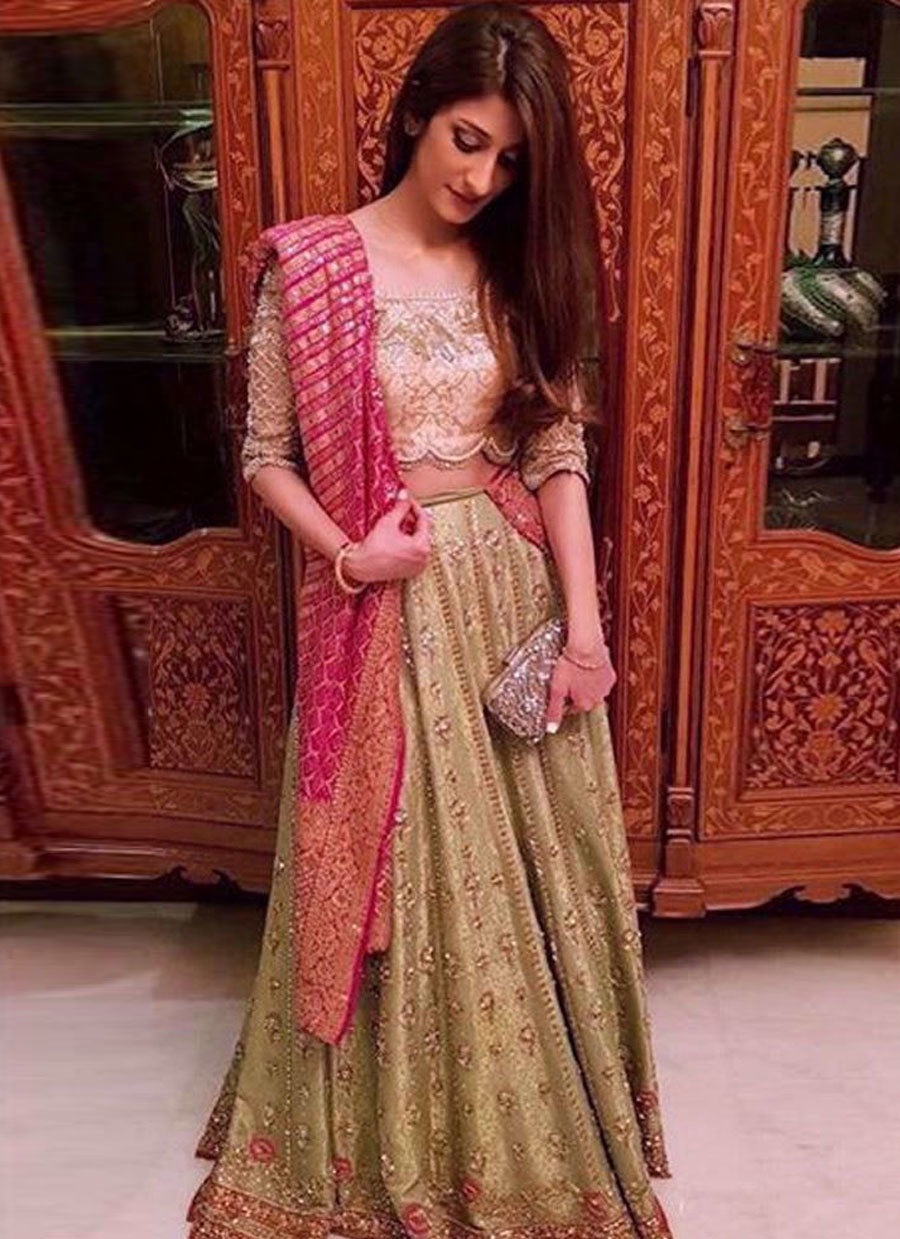 Alishay Adnan looking beautiful in a kiwi green Farah Talib Aziz lengha paired with a cutwork rose pink choli and magenta dupatta