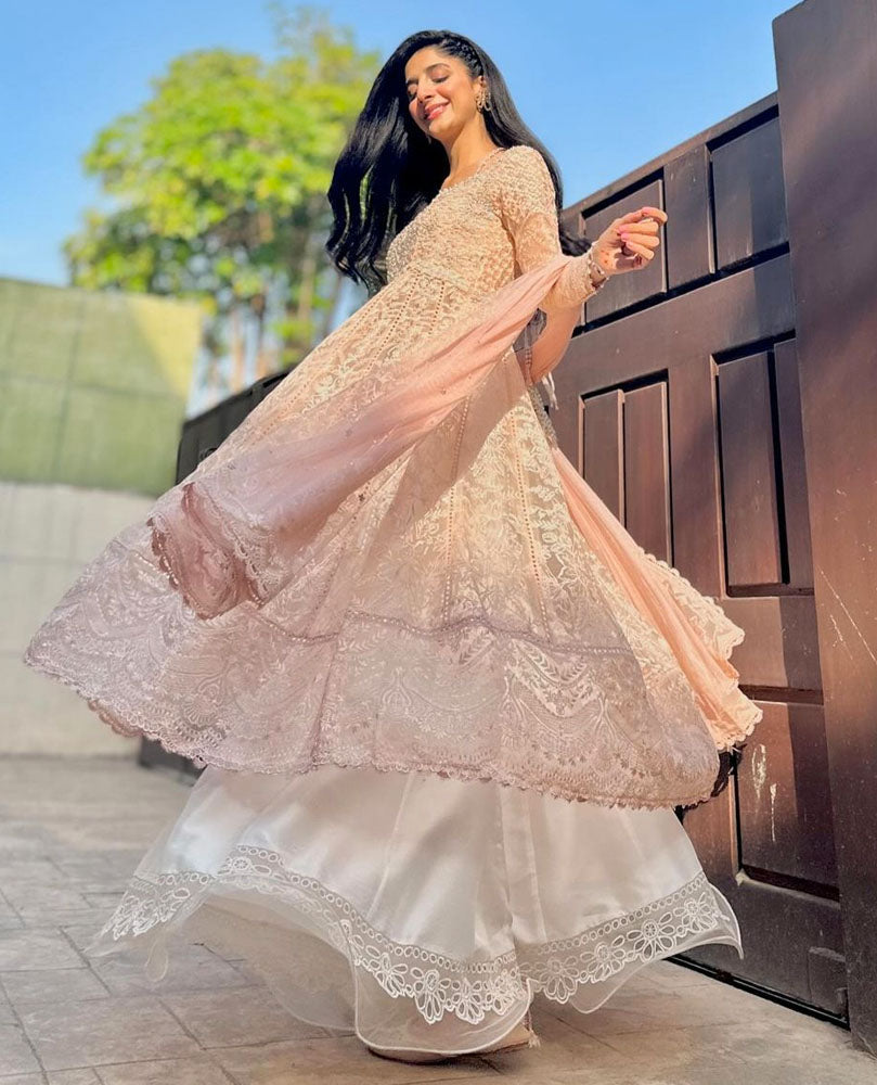 #MawraHocane glowing in that perfect golden hour light wearing a blush pink version of our much adored Maelle Ivory Kalidaar this Eid.