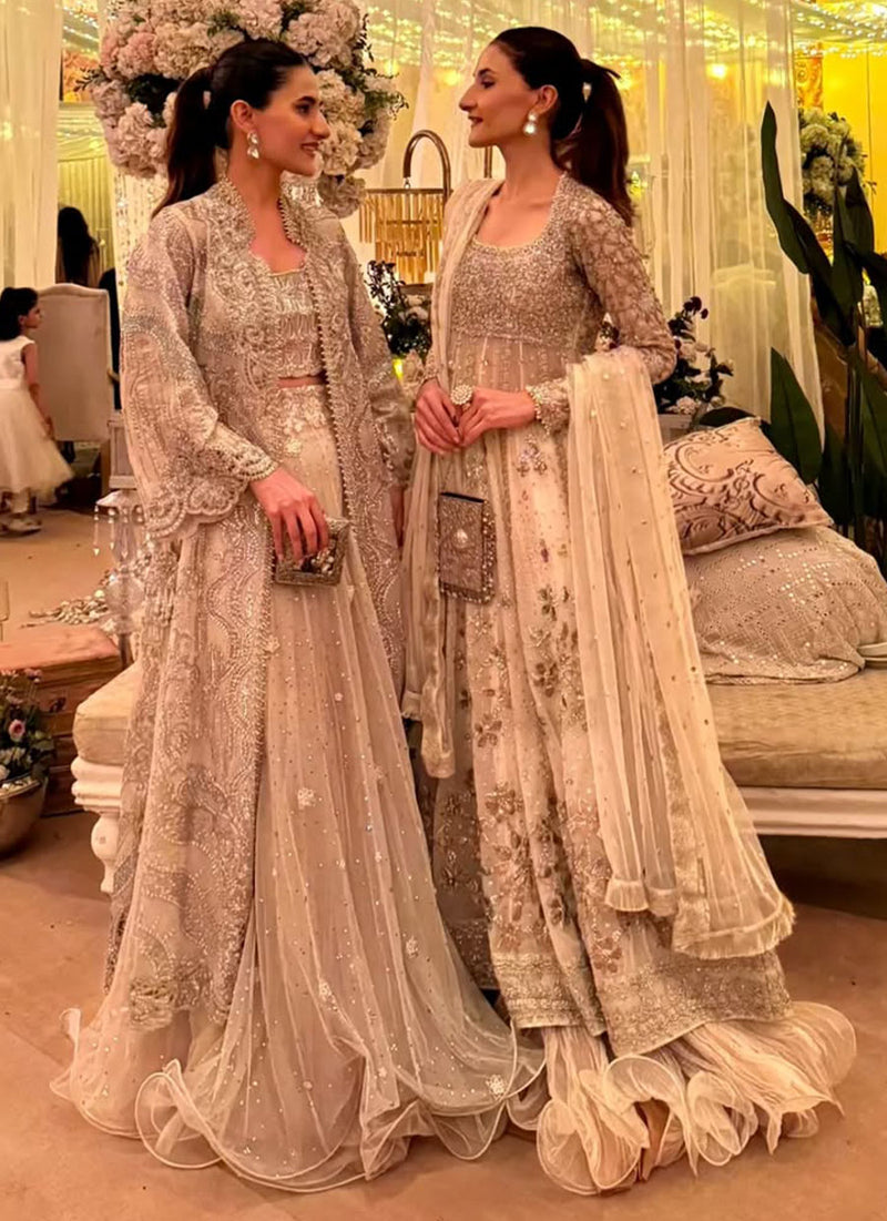 Umara And Kashaf Strikes In Sublime Ivory With Exuberant Gold-Toned Details.