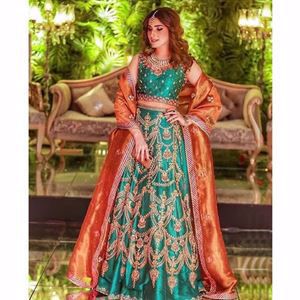 Dua Junejo in a signature Farah Talib Aziz jewelled toned lengha choli