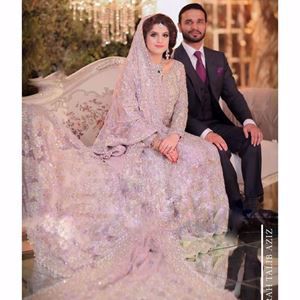 Kulsoom, a breathtaking bride on her wedding day in a lavender Farah Talib Aziz signature bridal