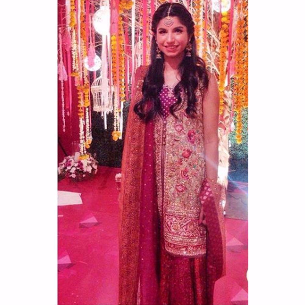 Mahwish Bhimjee looking beautifully festive in a mint, magenta and aubergine Farah Talib Aziz ensemble