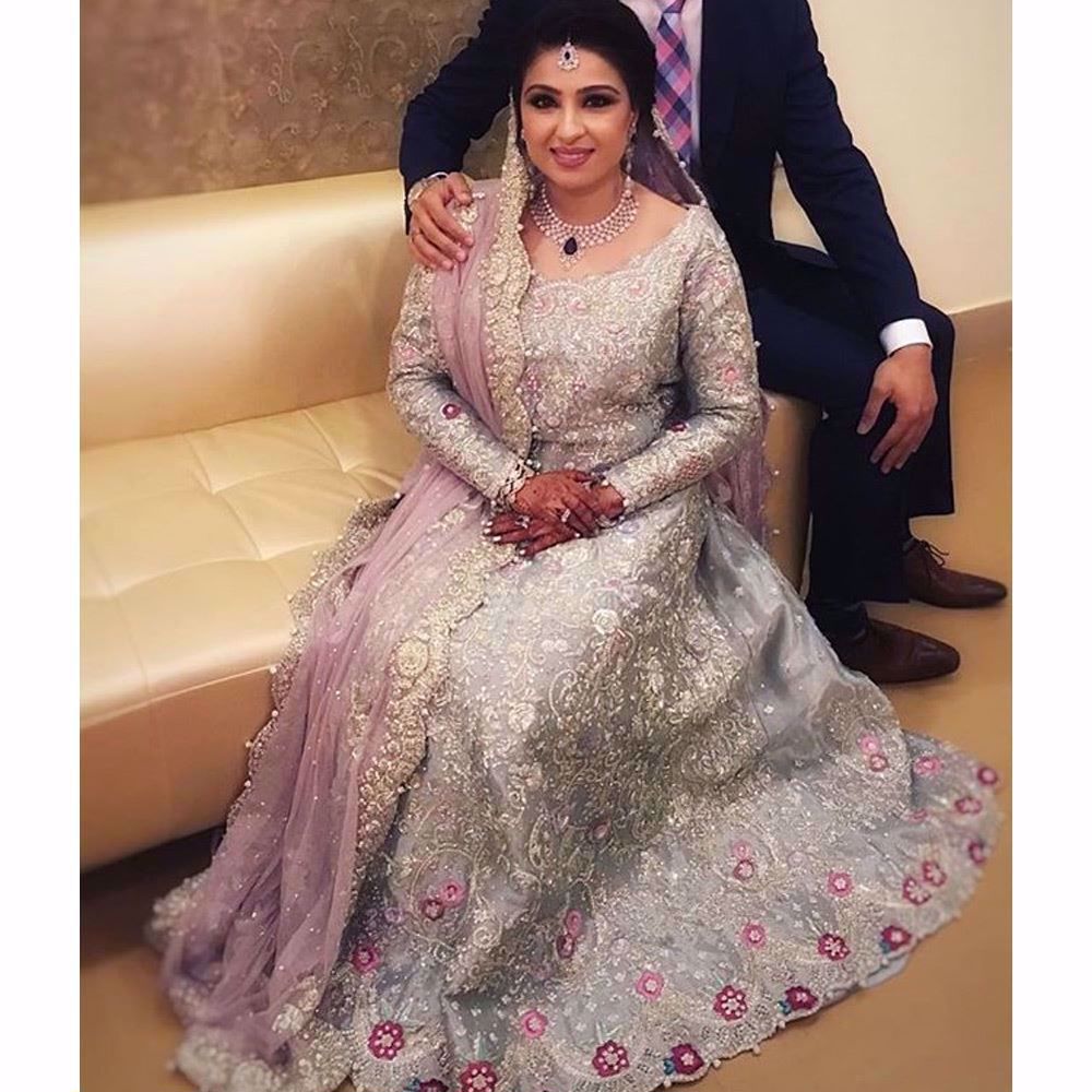 Bushra in an ice blue Farah Talib Aziz bridal featuring a filigree of silver and Swarovski embellishments