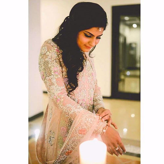 Fatima captures a magical moment in a Farah Talib Aziz blush pink bridal