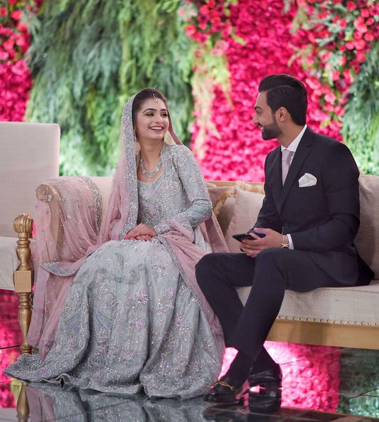 Sanila Arsal looking utterly mesmerising at her walima in this intricately hand-crafted silver ensemble brought to life with shades of lilac and blush pink