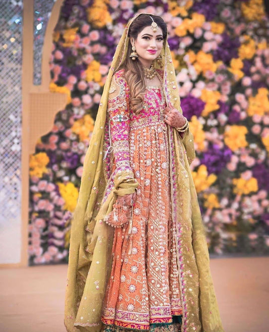 Nida Gillani at her mehndi in a signature #FarahTalibAziz ensemble. Vivid colours, intricate embroideries and tradtional silhouette, flawlessly come together to create a stunningly regal bridal look