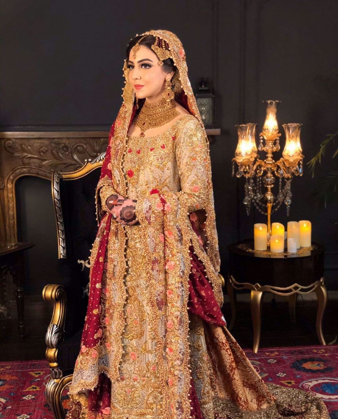 Maha looks absolutely ravishing at her wedding in a signature #FarahTalibAziz ensemble. A gold kameez offset with a scarlet dupatta, accentuated with gold embellishments and threadwork in shades of peach and scarlet