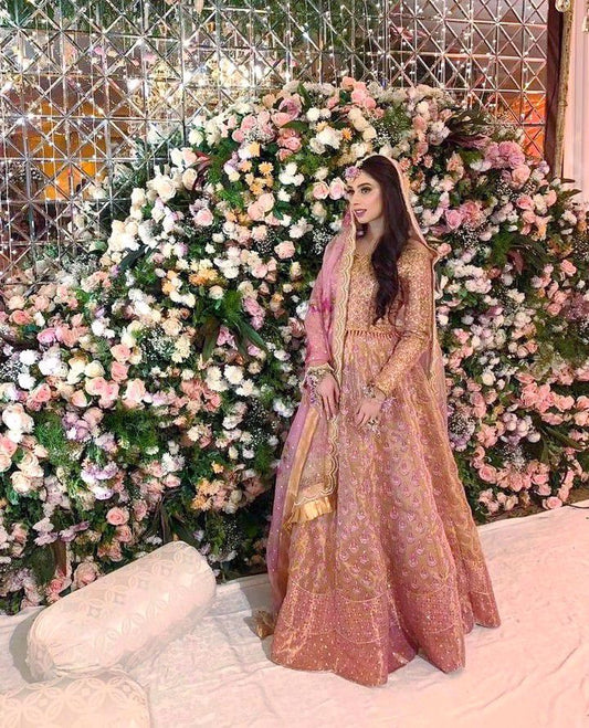 Alina Malik, breathtaking at her milad in a signature #FarahTalibAziz lehnga choli. Rose gold featuring a tulle florette dupatta to add the perfect flair